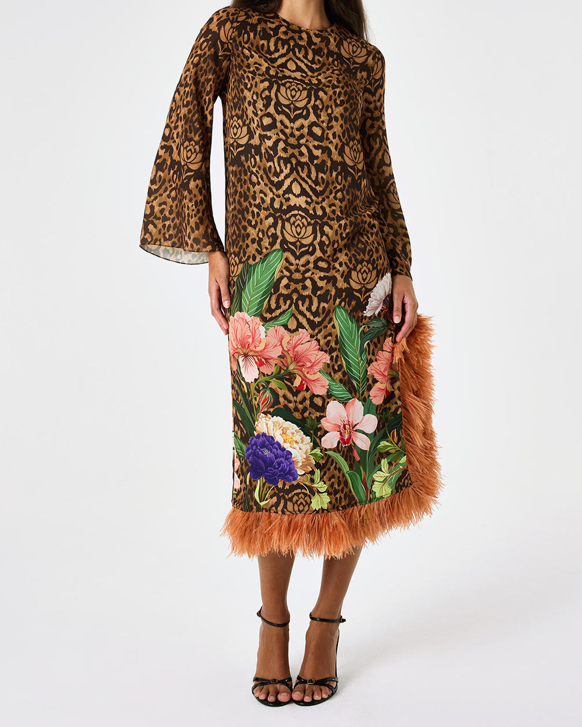Front view of Seraphina Crepe Dress in Leopard Floral with long sleeves and feather trimmed hem on model against white backdrop