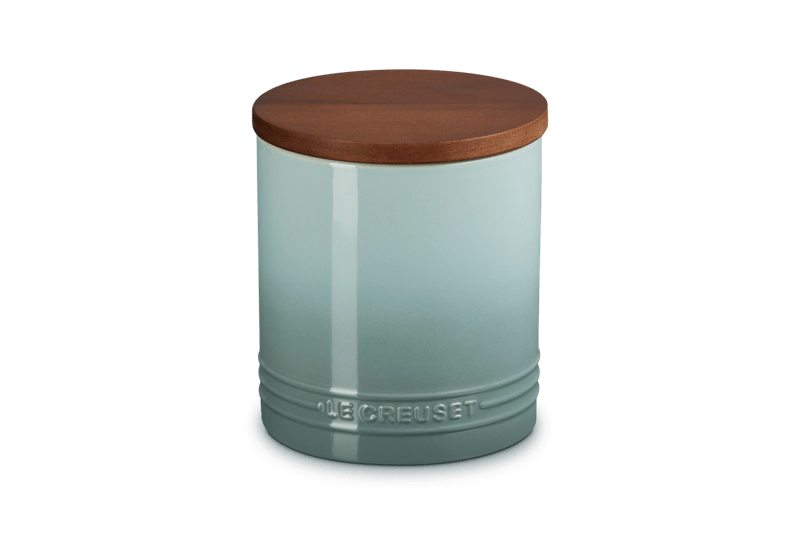 Front view of Signature Storage Canister in Sea Salt showing wood lid, airtight silicone gasket, enamel finish, and embossed Le Creuset logo