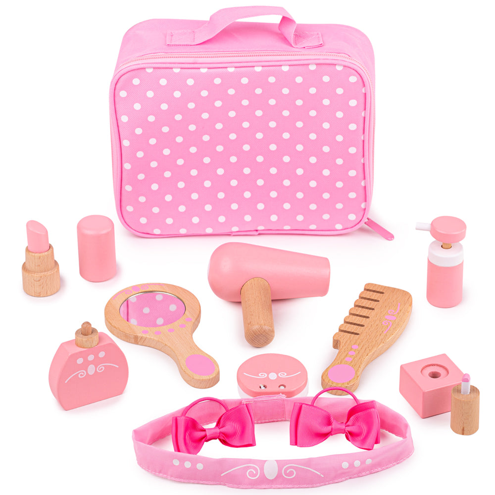Front view of Vanity Kit showcasing wooden role-play accessories and pink polka-dot fabric bag on white background