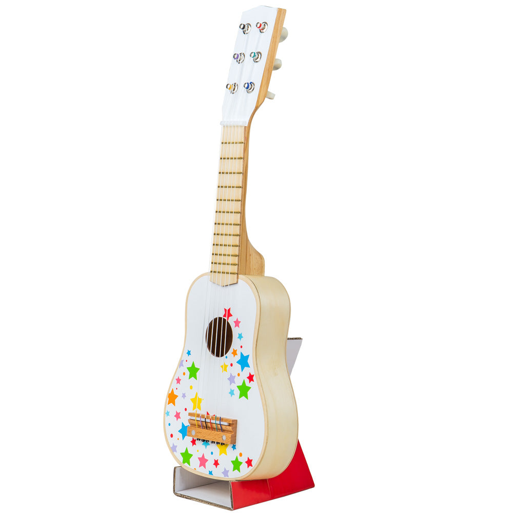 Front angled view of a wooden children’s guitar with colorful star design and six nylon strings on a display stand