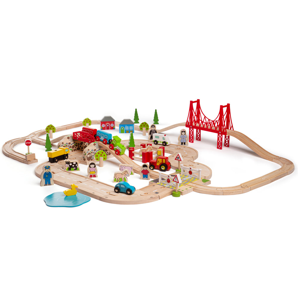 Three-quarter view of Road & Rail Train Set showcasing tracks, bridge, vehicles, and figures on a white background