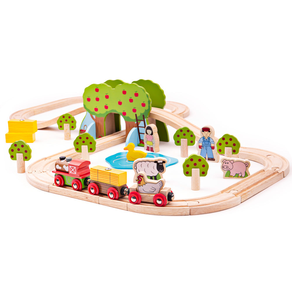 Front view of Farm Train Set showcasing wooden train track, train, farm animals, apple trees, and pond with white background