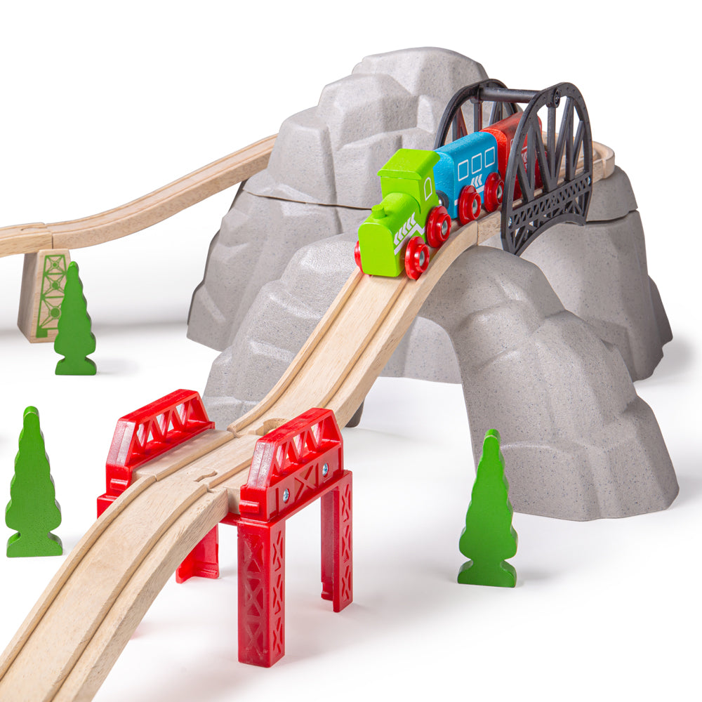 Angled view of Rocky Mountain Expansion Pack showcasing wooden train track and supports with a rocky mountain backdrop