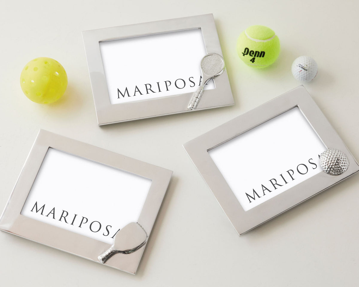 Angled view of Pickleball 5x7 frame with wide silver border and pickleball paddle ornament on light gray background