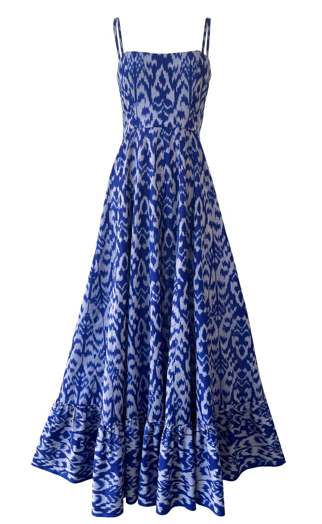 Front view of Aquarius dress with blue ikat print, fitted corset bodice, spaghetti straps and flared panelled skirt