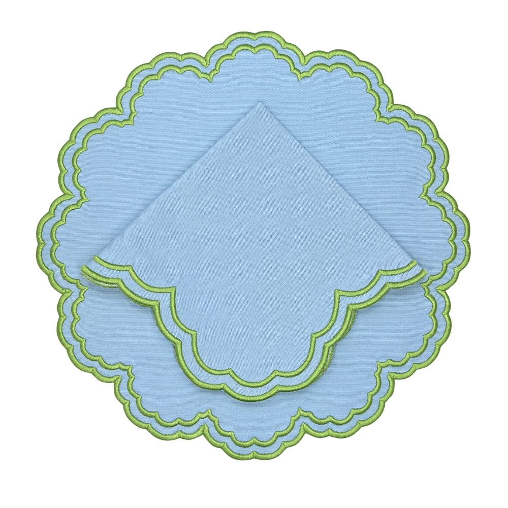 blue  placemat and napkin with green embroidery