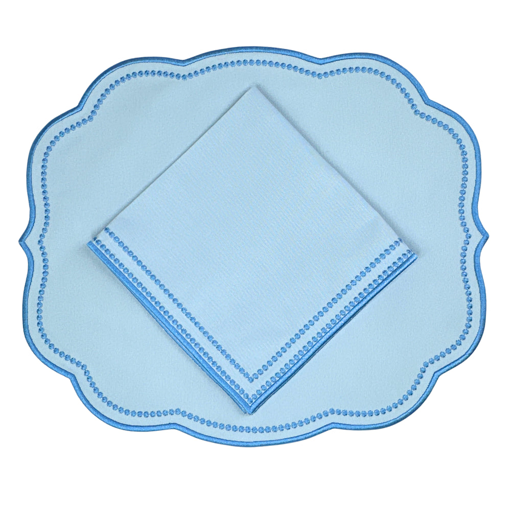 Luxury Light blue napkin with a blue dot pattern and blue embroidery  and matching Light blue scalloped placemat 