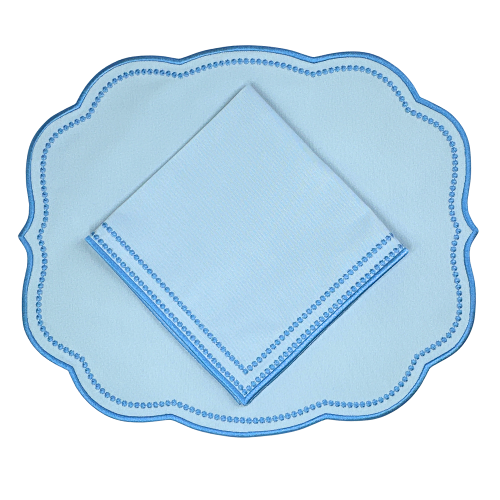 Luxury Light blue napkin with a blue dot pattern and blue embroidery  and matching Light blue scalloped placemat 