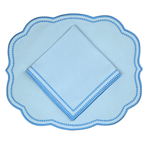 Luxury Light blue napkin with a blue dot pattern and blue embroidery  and matching Light blue scalloped placemat 