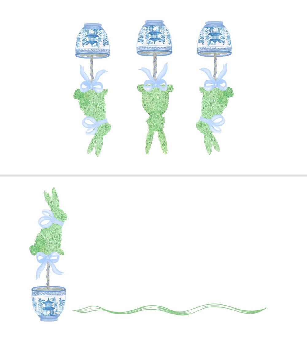 Decorative set with topiary trees, lanterns, and ribbons on a white background