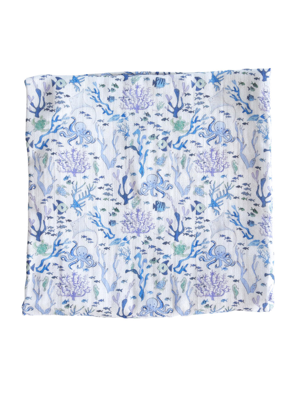 Flat lay of Coral Reef Shawl Blanket showing blue and purple coral reef and sea creature print on white organic cotton fabric