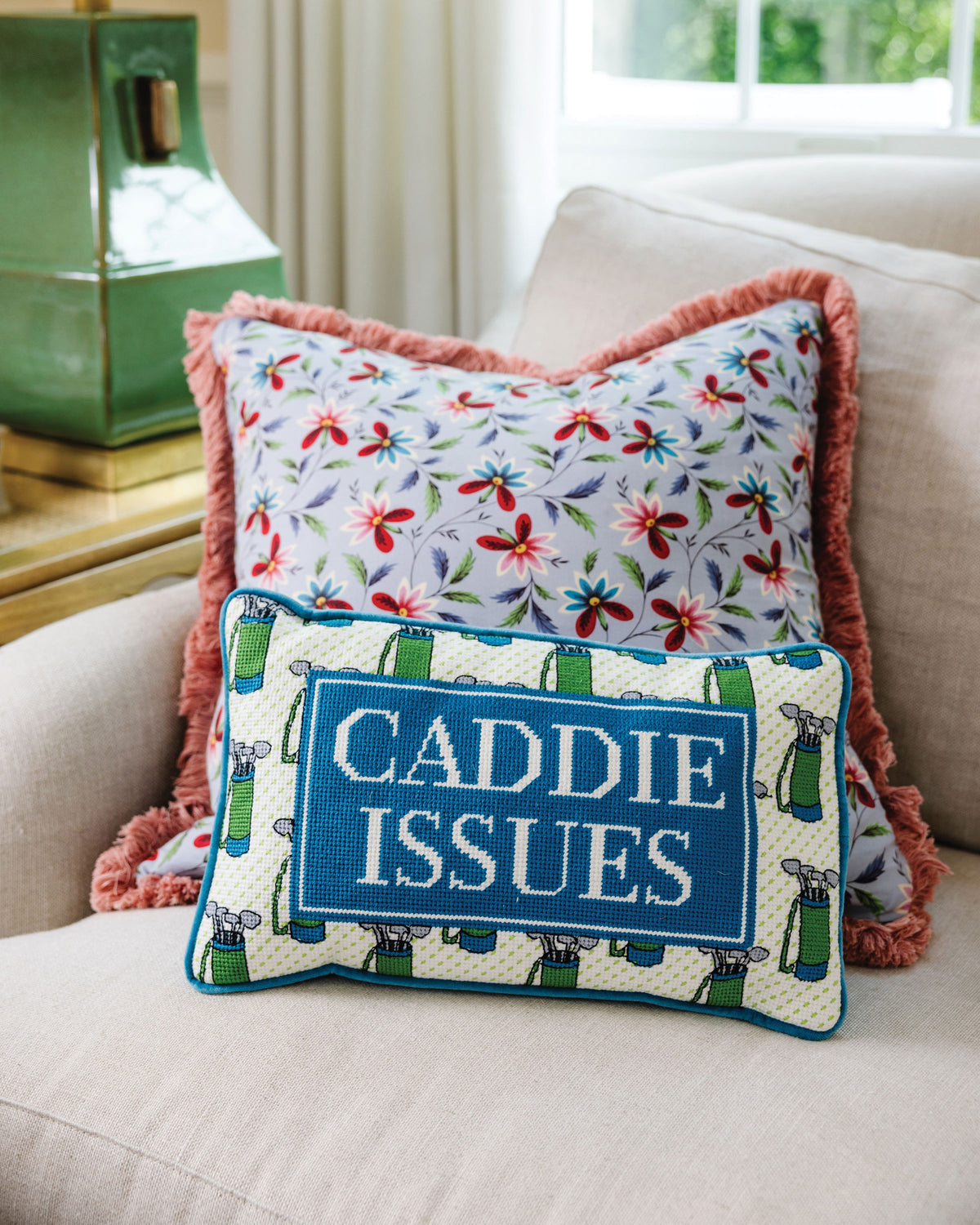 Caddie Issues Needlepoint Pillow - styled on sofa