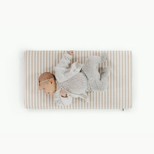 Cafe Stripe@overhead of a baby on the cafe stripe padded micro+