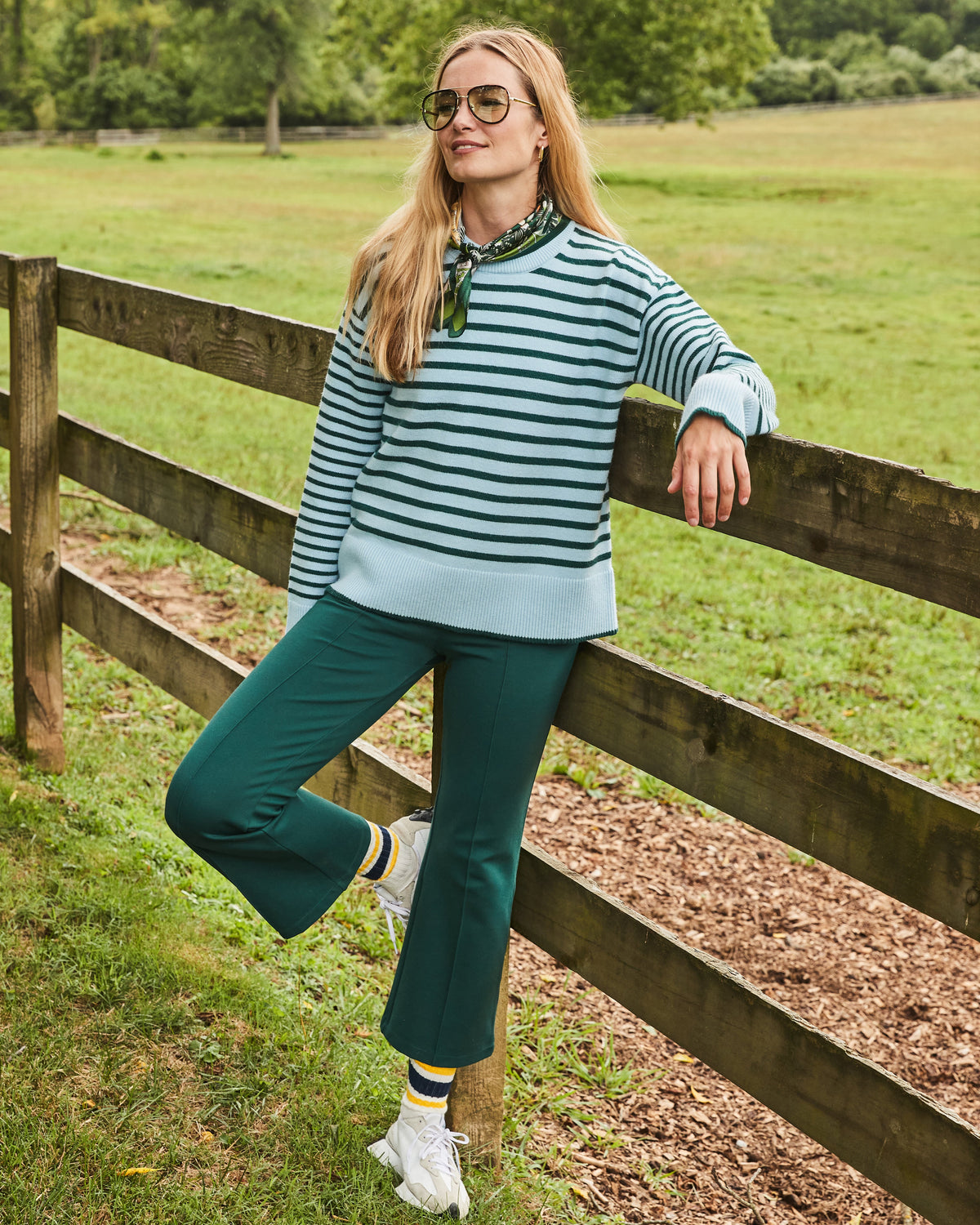 Model is wearing the Carlyle Crewneck in Baby Blue/ Ivy Stripe with the Waverly Pants in Ivy