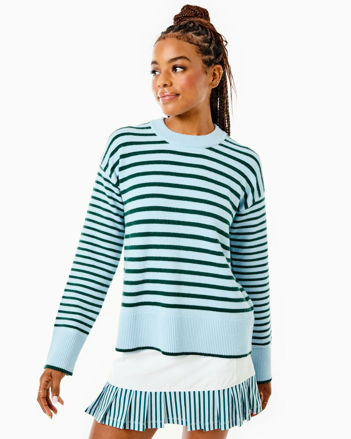 Model is wearing the Carlyle Crewneck in Baby Blue/ Ivy Stripe with the Court Skort in Super White/ Ivy/ Baby Blue Stripe