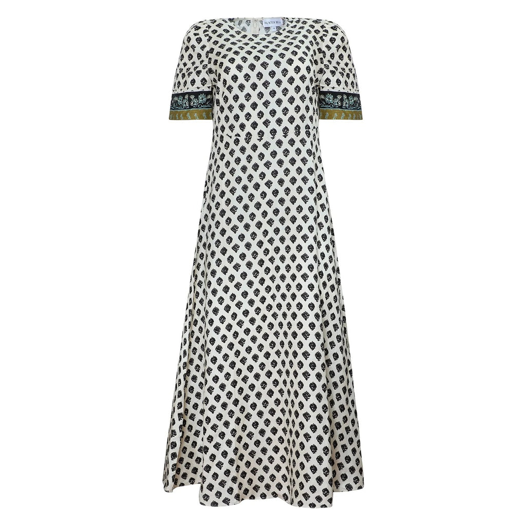 Front view of Casey Dress in Thistle & Vine Cream showcasing black leaf motifs, short sleeves, and circle skirt