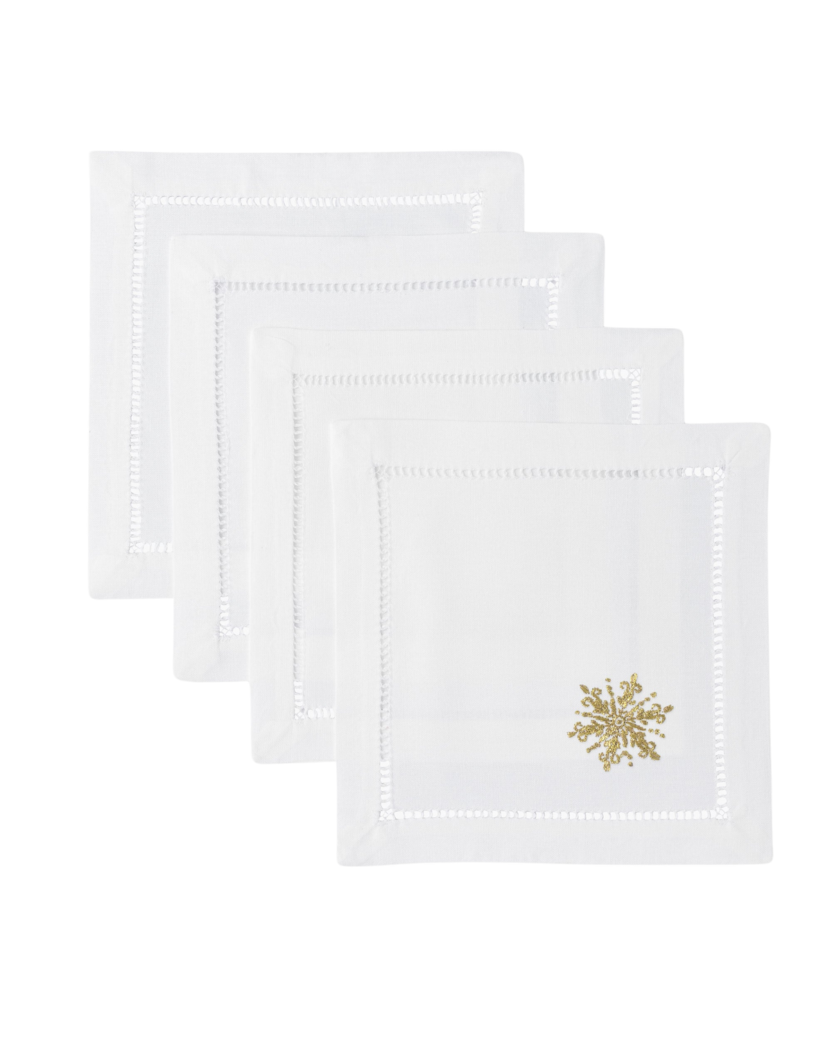 Front view of Snowflake Gold Cocktail Napkin Set showcasing four white cotton napkins with gold snowflake embroidery on black