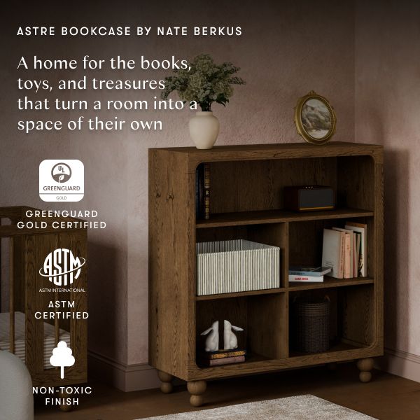 Front view of Astre bookcase by Nate Berkus in Toffee with open shelves and text A home for books toys and treasures