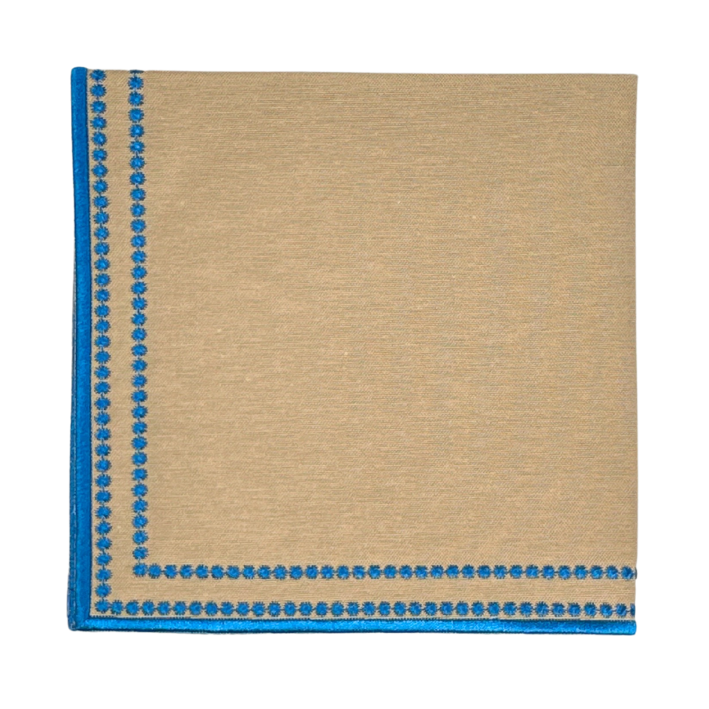 luxury tan napkin with blue decorative border 