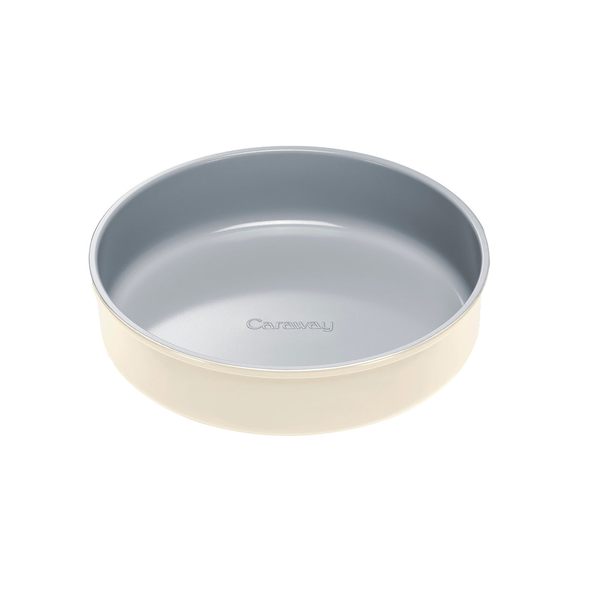 Angled top view of Circle Pan showing gray non-toxic ceramic interior, cream exterior and embossed Caraway logo on white background