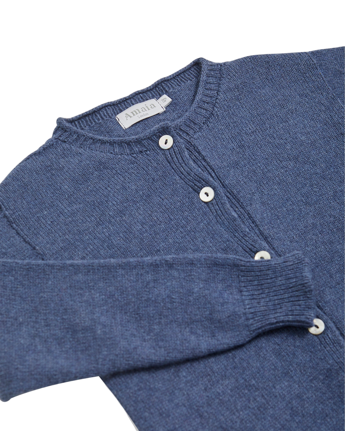 Blue sweater with buttons on a white background