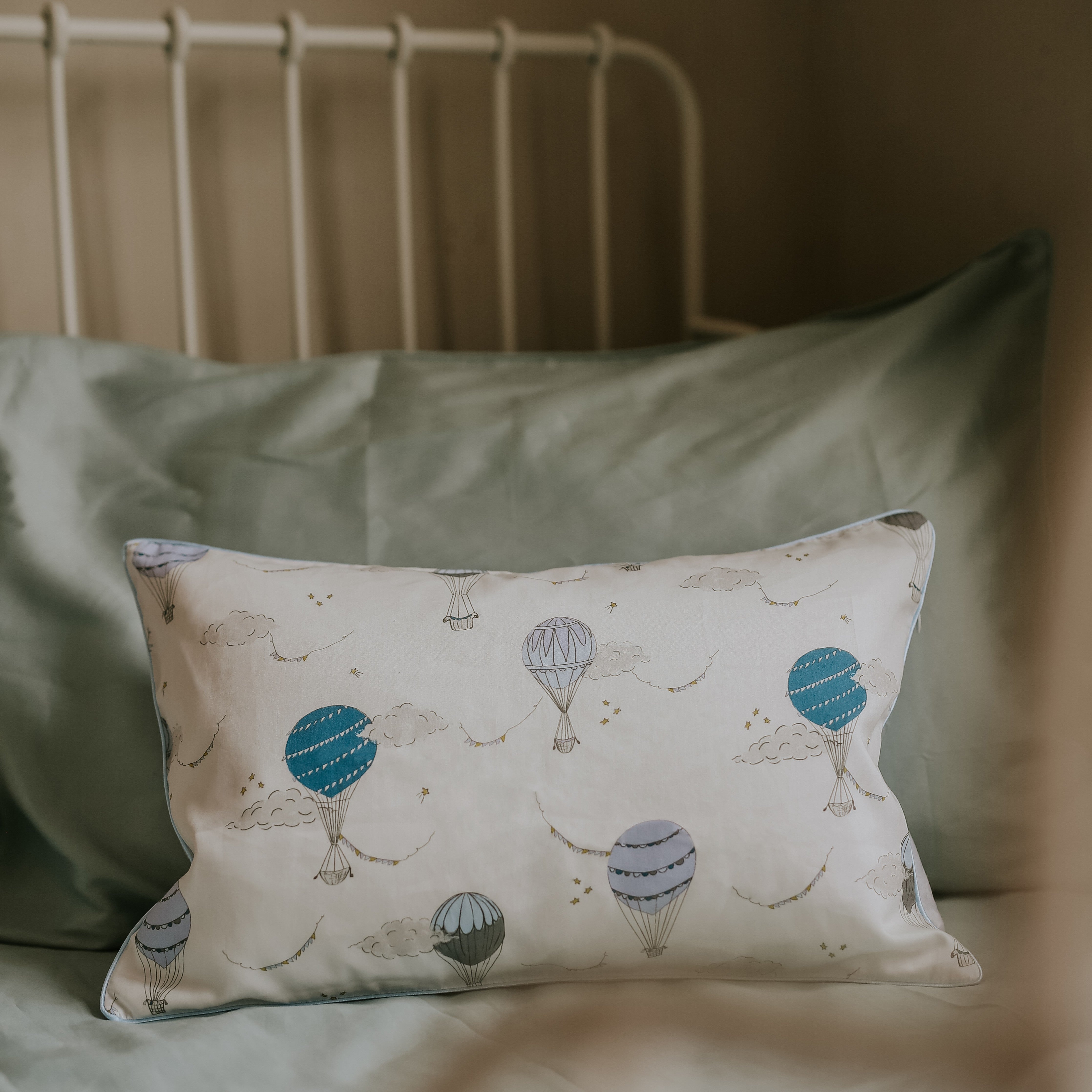 Toddler pillow in "Touch The Sky" print in the color blue