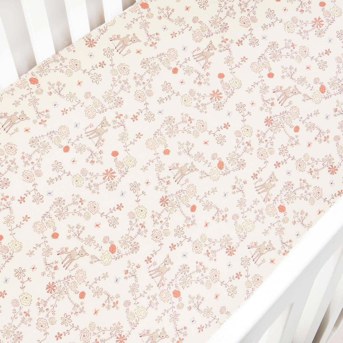 Crib Sheet in "Into The Woodlands" print in the color ivory featured in a crib