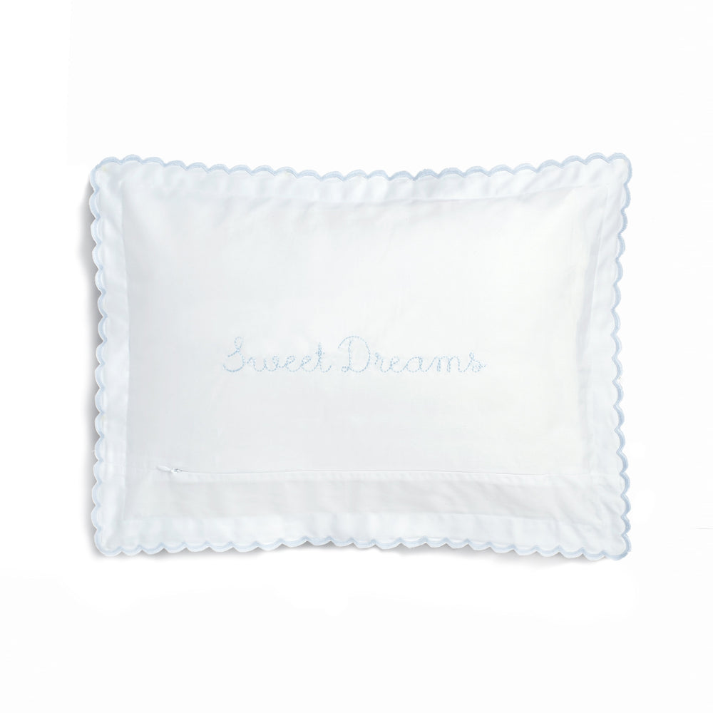 Front view of Picnic Gingham toddler pillow with blue Sweet Dreams embroidery and scalloped blue trim on white background