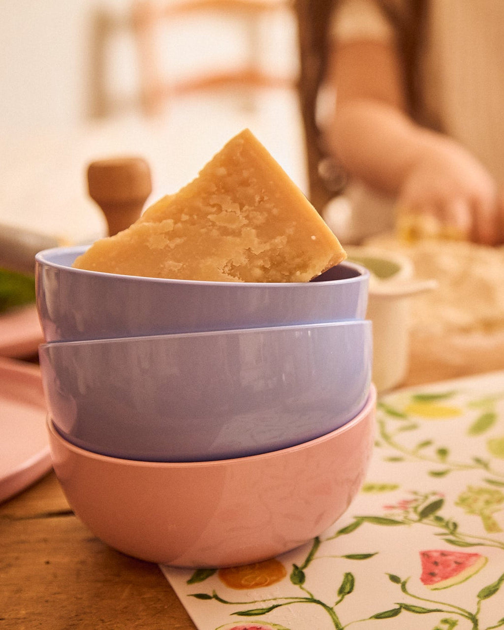 Pastel bowls on a warm wooden table