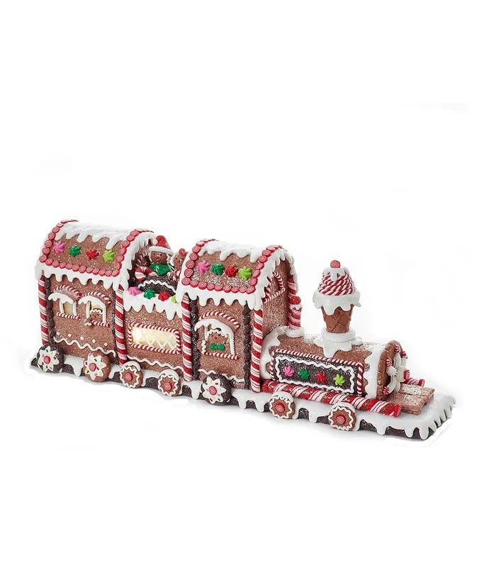 Side view of 19.5 inch gingerbread train with candy and frosting details, glittered surface, battery-operated LED lights