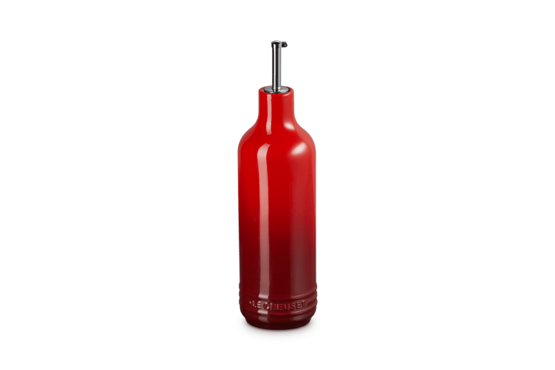 Front view of Signature Oil Cruet in Cerise showcasing its curved stainless steel pour spout and sculptural three-ring design