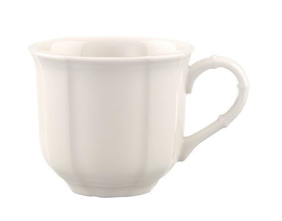 Front three-quarter view of Manoir Espresso Cup in White showcasing its compact porcelain design and handle on a white background