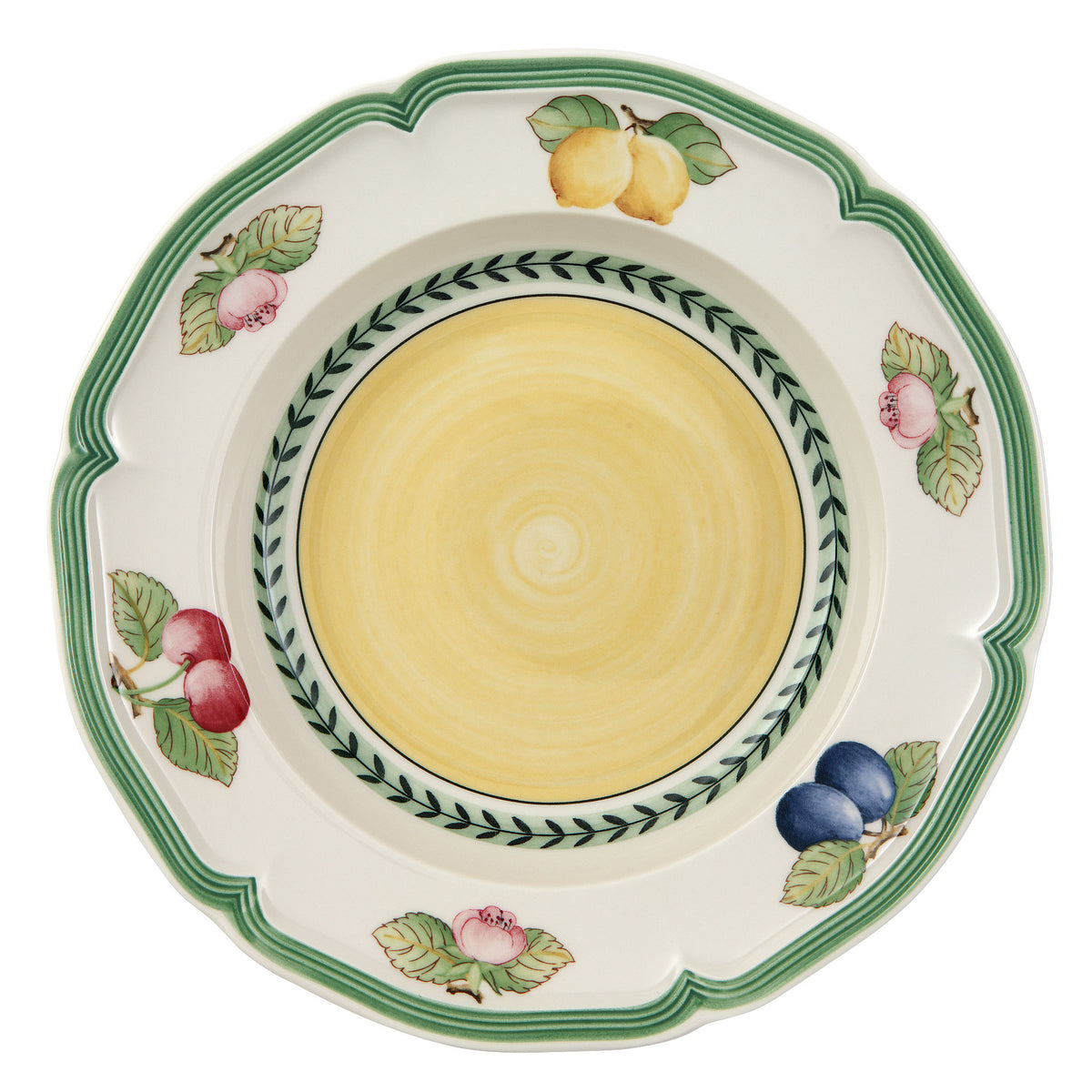 Top view of Fleurence soup plate with scalloped green rim, yellow center, and fruit and floral motifs