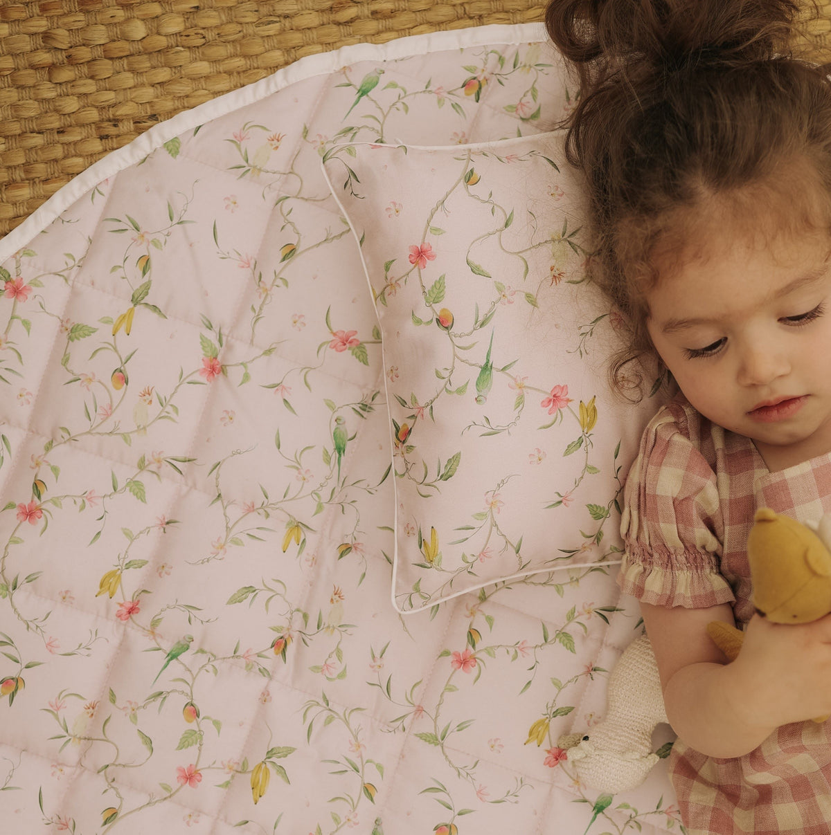 Dreaming of Paradise Playmat with little girl laying on top playing