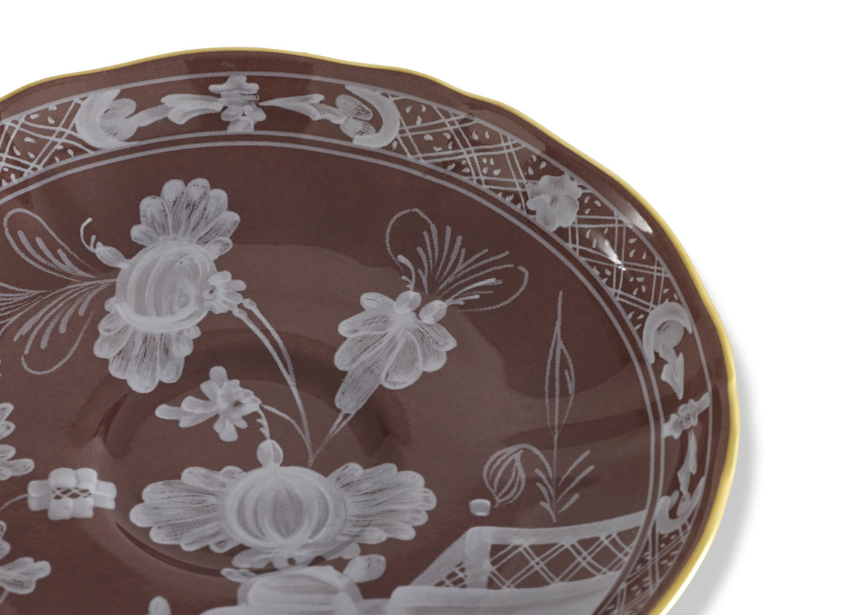 Close-up of Oriente Italiano Antico Doccia Coffee Saucer in Castagna with white floral motifs and gold-plated rim