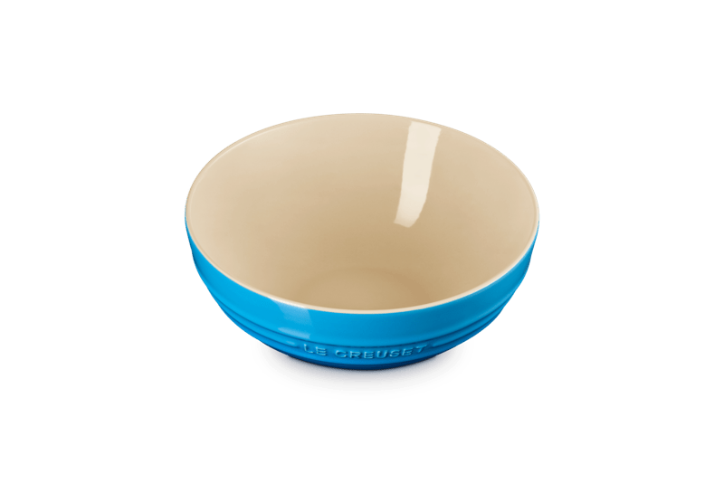 Angled view of Multi Bowl, 3.1 qt. in Marseille showcasing blue glazed stoneware with cream interior on a plain background