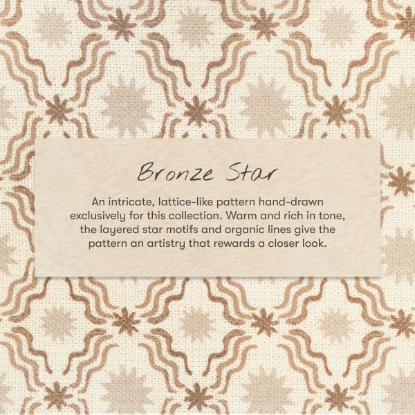 Close-up of Mini Crib Sheet in Bronze Star pattern showcasing layered star motifs on cream fabric