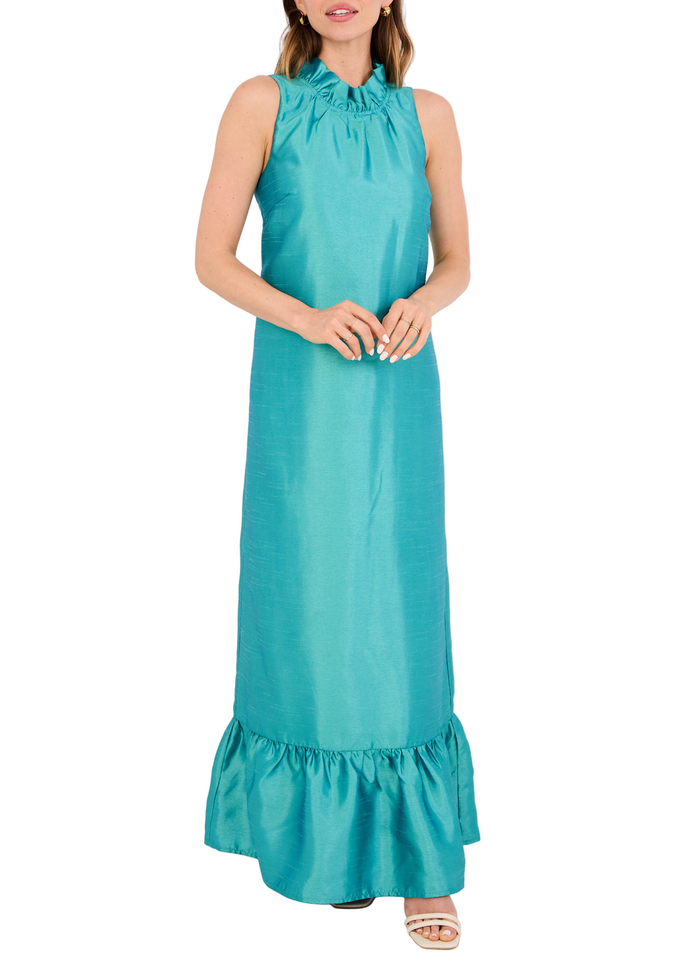 Front view of Camille Gown in teal dupioni on model, sleeveless column silhouette with ruffle neckline and hem on white