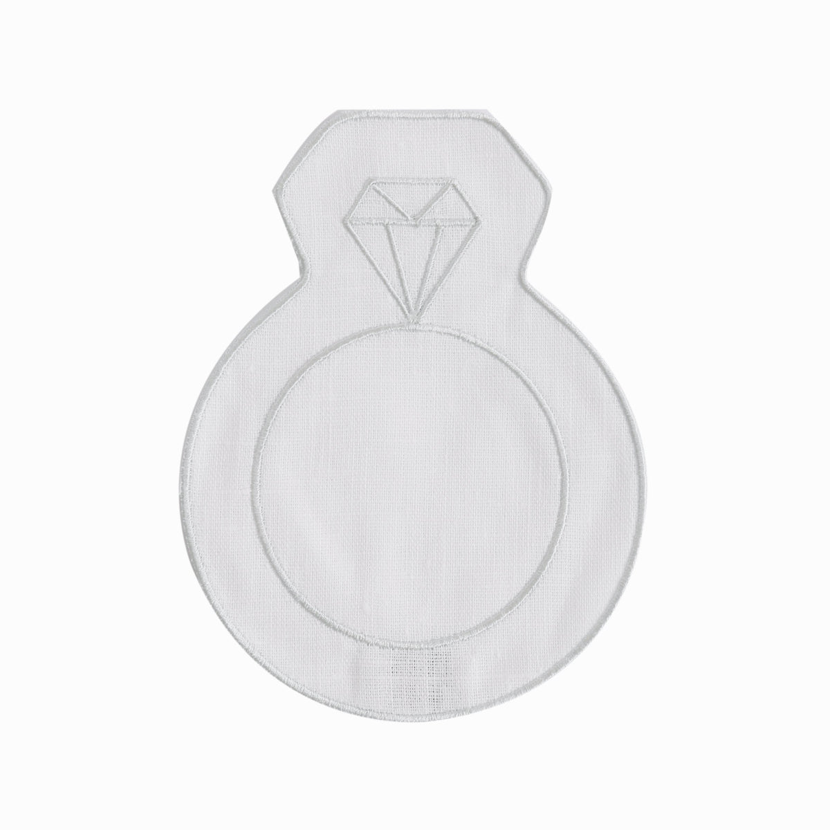 Top-down view of ring-shaped engagement cocktail napkin with embroidered diamond motif on white background