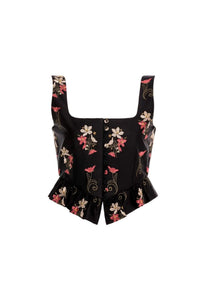 Front view of Eslabón Noche Cropped Top in black, showcasing floral embroidery, button placket, and gathered peplum hem