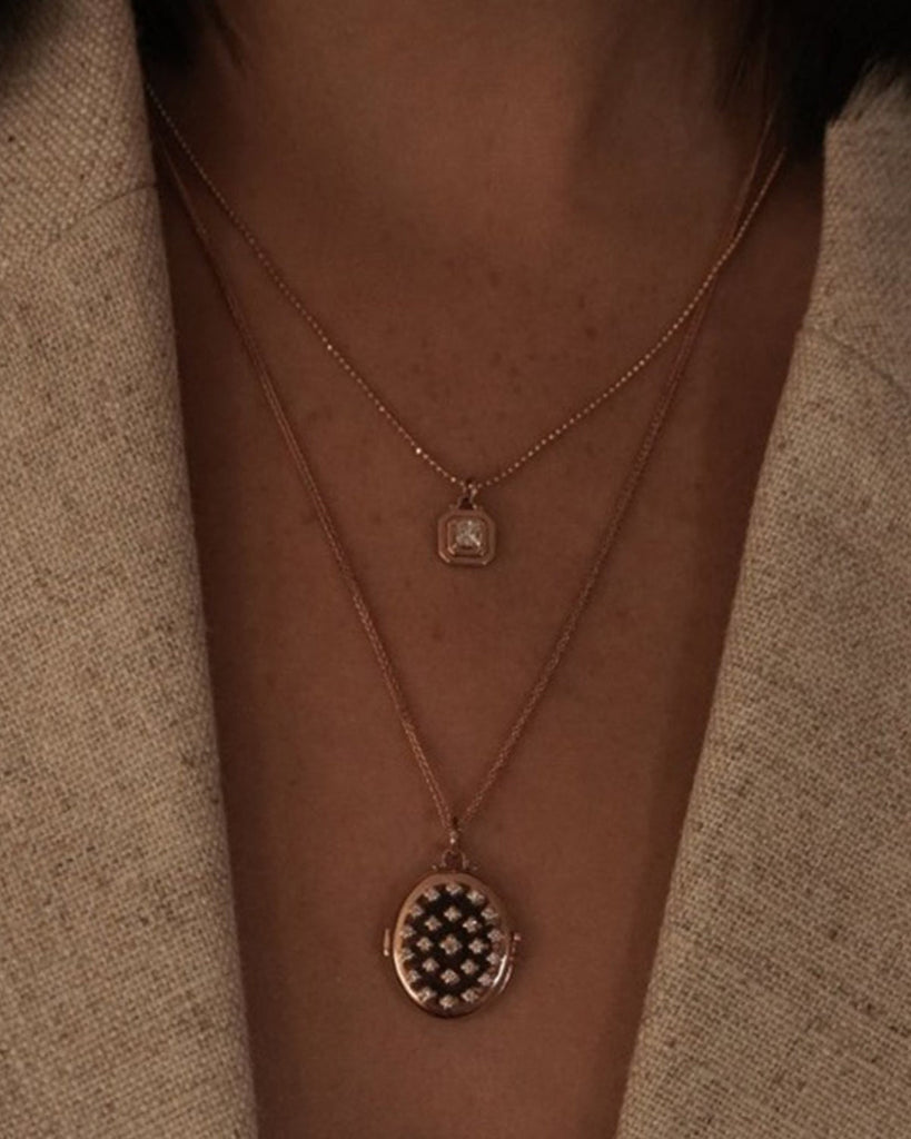 Etoile Locket Necklace shown with the Princess Necklace, Love Lock Ring, and Medusa Ring, 14k yellow gold