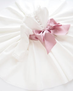 Eugenie Dress Pink, refined crepe dress completed with a big rose bow
