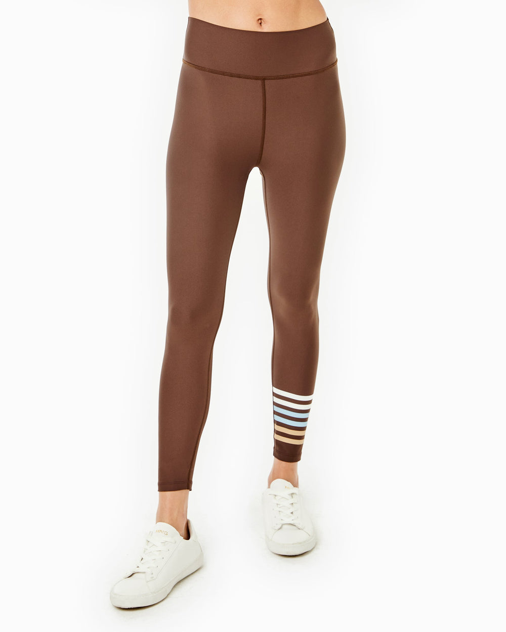 Front view of the Everyday Legging in Chocolate showing a high-rise waistband and multicolor stripe at the lower leg on a white background