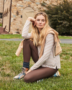 Model is wearing the Everyday Long Sleeve in Latte Stripe with the Everyday Legging in Chocolate