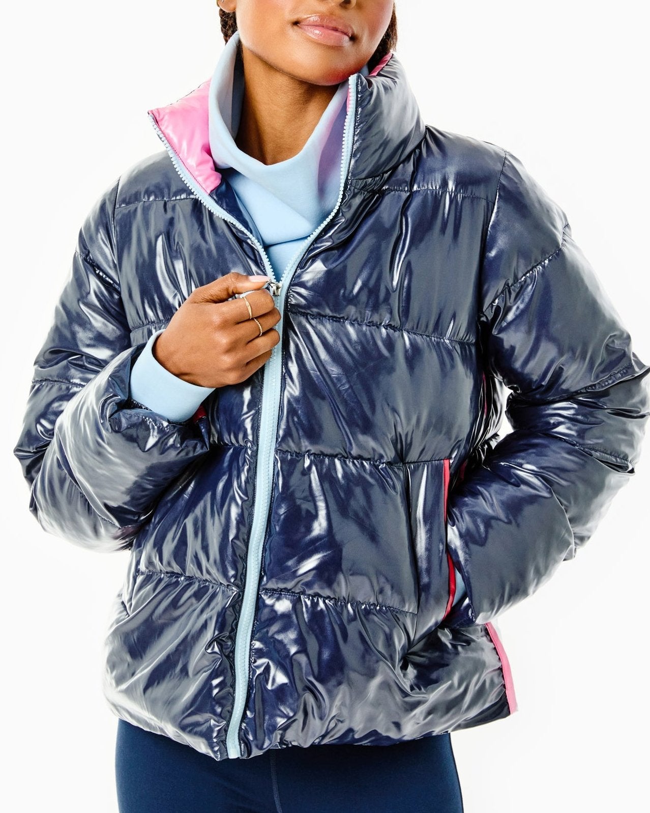 Model is wearing the Everyday Puffer Coat in Navy with the Everyday Pullover in Baby Blue and the Colleen Pants in Navy