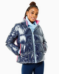 Model is wearing the Everyday Puffer Coat in Navy with the Everyday Pullover in Baby Blue and the Colleen Pants in Navy