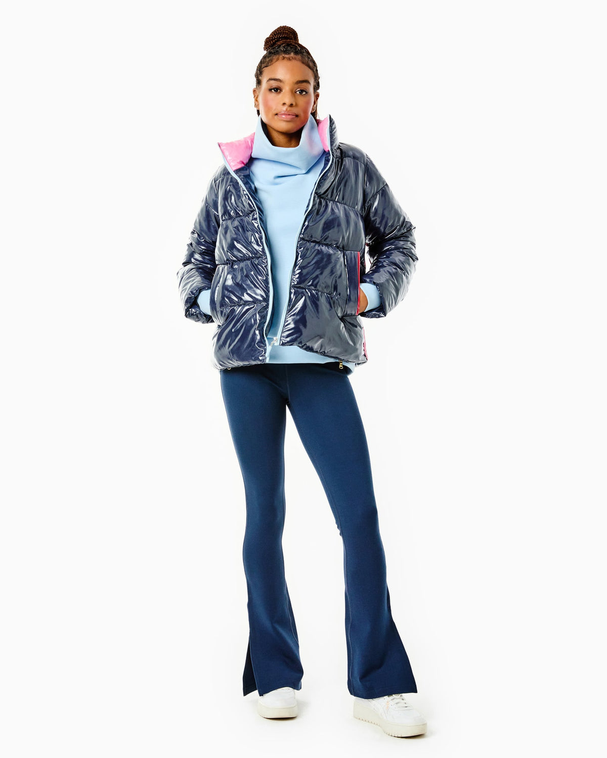 Model is wearing the Everyday Puffer Coat in Navy with the Everyday Pullover in Baby Blue and the Colleen Pants in Navy