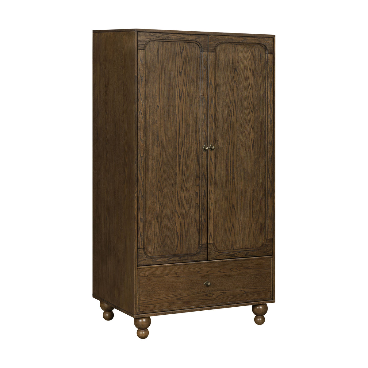 Three-quarter view of Astre Assembled Armoire by Nate Berkus in Toffee with paneled doors, drawer, and turned feet