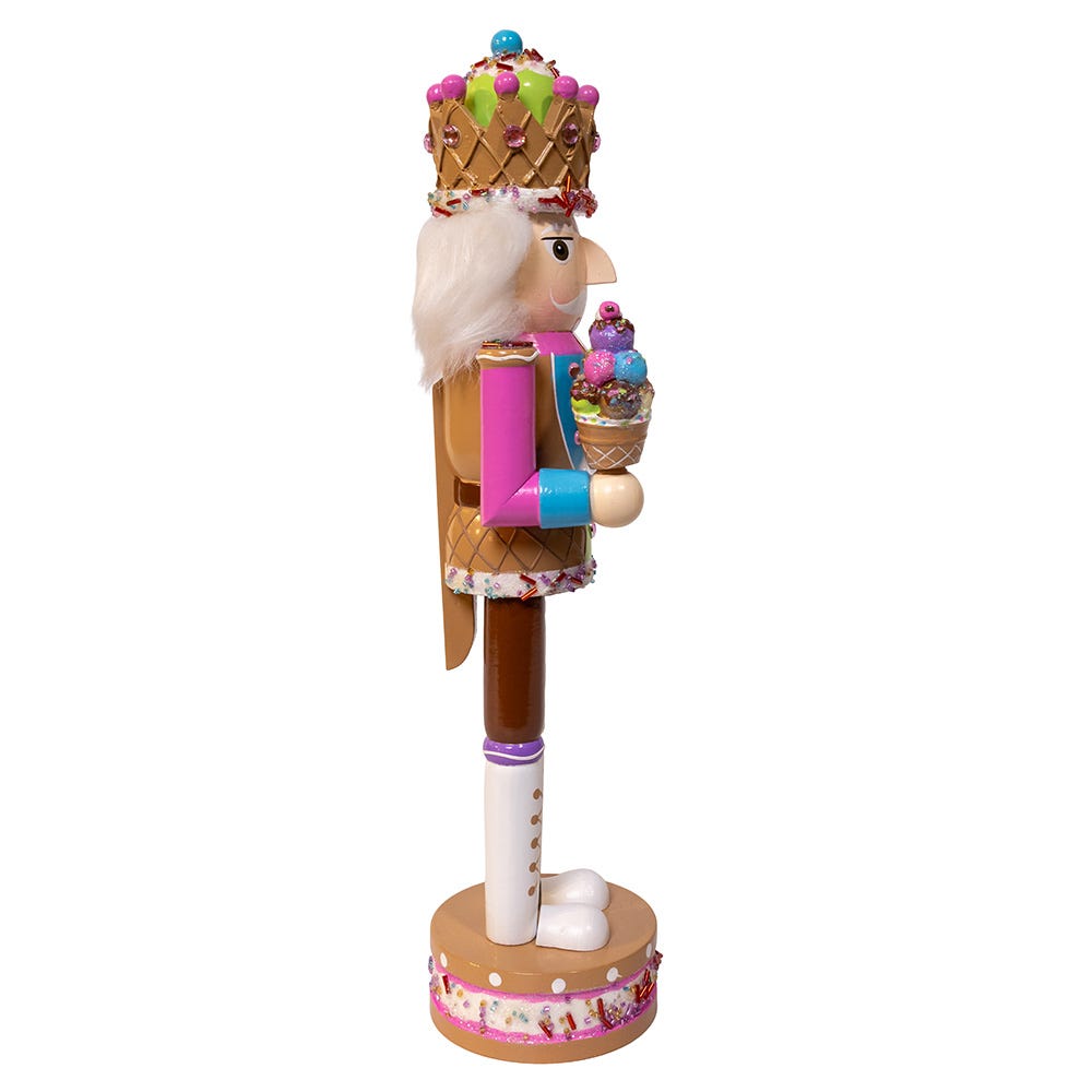 Side view of Ice Cream Nutcracker showcasing its colorful ice cream-themed outfit and cone with a white background