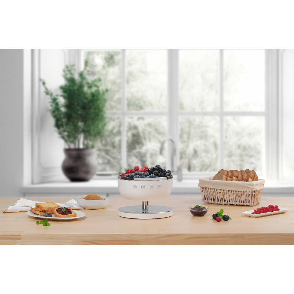 Front view of Digital Kitchen Scale in Matte White showcasing its removable stainless-steel bowl filled with berries on a kitchen counter